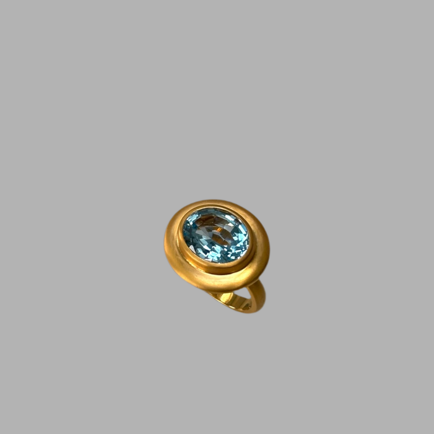 Sky blue Topaz ring with wide border in satin gold vermeil