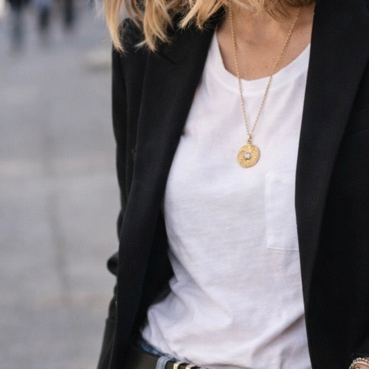 Woman wearing ancient gold medallion 