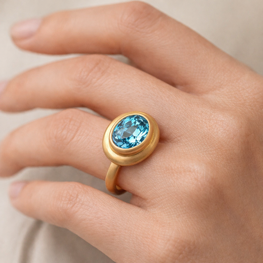 Sky blue Topaz ring with wide border in satin gold vermeil