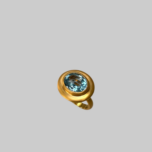 Sky blue Topaz ring with wide border in satin gold vermeil