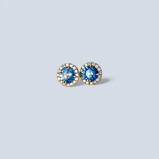 A pair of sapphire stu earrings with the diamond hallo in 18ct gold